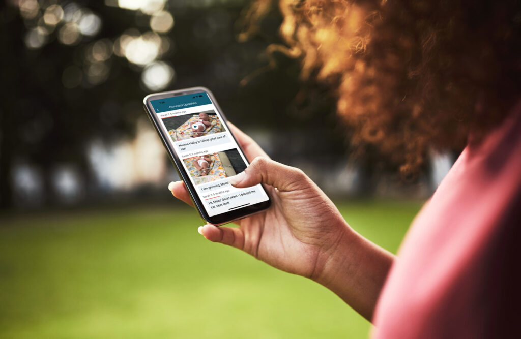 parent on mobile phone patient connect app